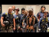 Kids who got trapped in elevator reunite with firefighters who rescued them