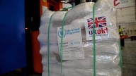 Thousands of tonnes of UK aid for Gaza stuck in Jordan