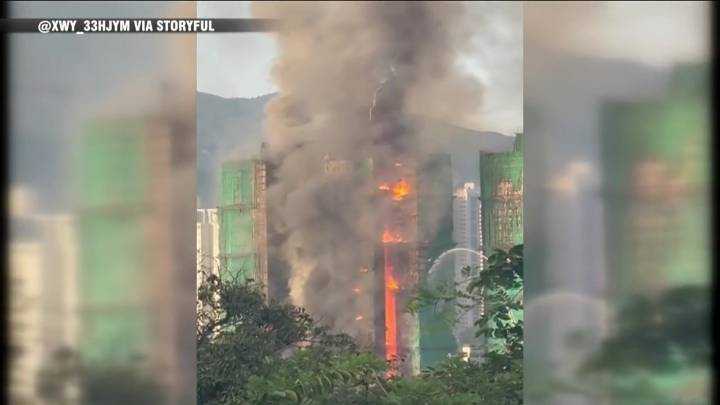 13 people killed in fire engulfing Hong Kong high-rise residential buildings, fire services say