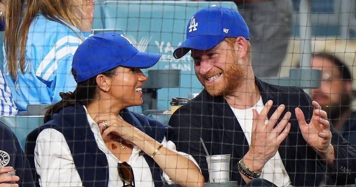 Harry says he was 'under duress' as he apologises after being pictured in stands with Meghan
