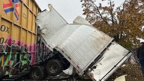 A train struck a tractor-trailer in Portage. What police are saying