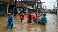 Deadly floods swamp homes in Thailand as residents wait for aid