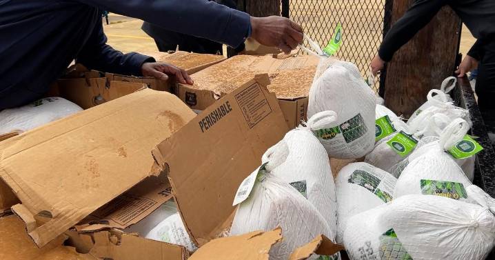 Locals get free meals during a Thanksgiving food giveaway