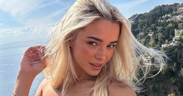 Livvy Dunne Posts Glam Bathroom Selfie in Statement Dress