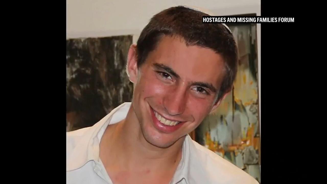 Convoy carrying what is believed to be the remains of a hostage arrives at Tel Aviv's forensic institute