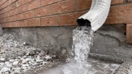 The Major Downside To Not Using A Downspout To Protect Your Home