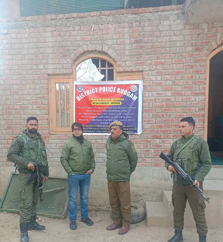 Police attach property of notorious drug peddler in Budgam