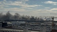 Firefighters battle 4-alarm fire at warehouse in Southeast Baltimore