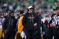 Moore throws 2 TD passes and No. 6 Oregon derails No. 16 USC's CFP hopes with a 42