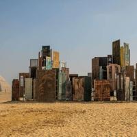 Monumental art displayed in shade of Egypt's pyramids