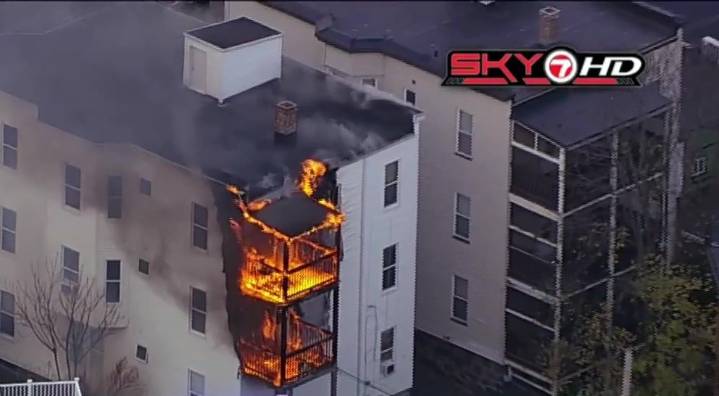 Triple-decker home in Roslindale goes up in flames, 7 people displaced