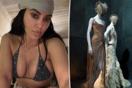 Kim Kardashian swims in the ocean wearing historic Alexander McQueen dress shown at the Met