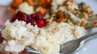Cheesy baked rice is a can't miss Thanksgiving side dish