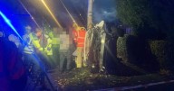 Man rescued after car is flipped onto side and smashes onto pavement