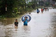 69 dead after floods, landslides in Indonesia