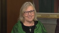 Why did Elizabeth May decide to support the budget?