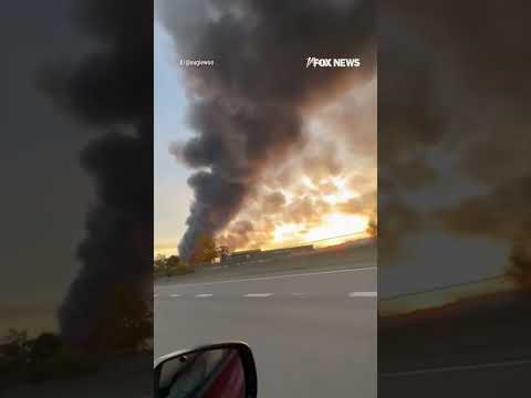 WATCH: Billowing smoke can be seen for miles after a UPS plane crashes #ups #shorts #plane #crash