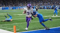 J.J. McCarthy throws for 2 TDs and runs for a score in his return as Vikings beat Lions 27