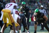 Moore throws 2 TD passes and No. 6 Oregon derails No. 16 USC’s CFP hopes with a 42