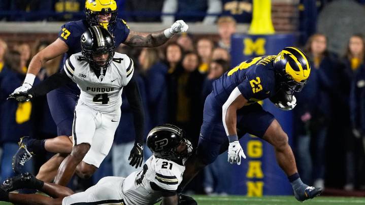 Jordan Marshall runs for 185 yards and 3 TDs to help No. 21 Michigan hold off Purdue for 21