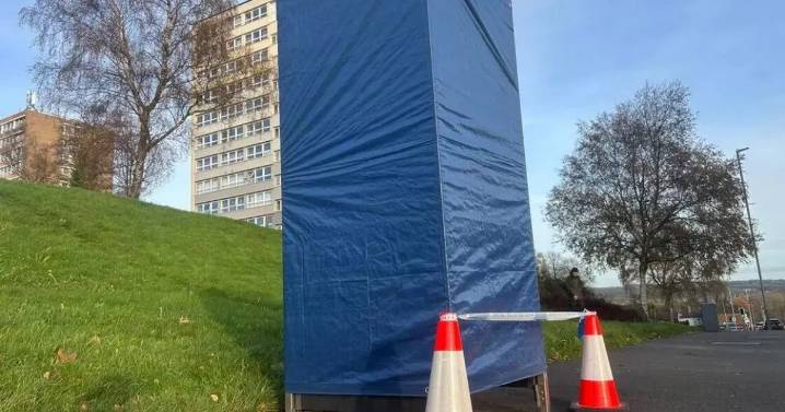 Phone box is taped up by murder cops after man is found dead in flat
