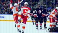 Flames score 4 times in 3rd, pull away from Sabres