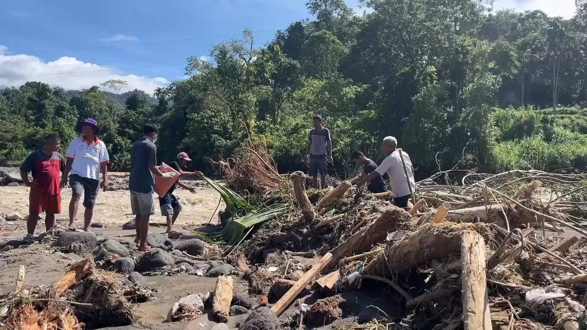 Search for survivors in Indonesia as the death toll from floods and landslides rises
