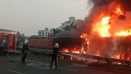 Five killed as car gets crushed between two container trucks engulfed in flames in Pune