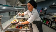 Johnson & Wales students work in university dining halls