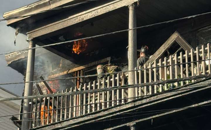 Two-alarm fire hits Hyde Park triple decker