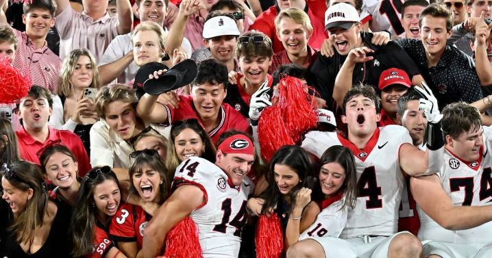 PHOTOS: Georgia football players celebrate with fans in the end zone after win over Florida