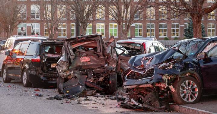 Driver dies after running red light, crashing into parked vehicles in Manchester