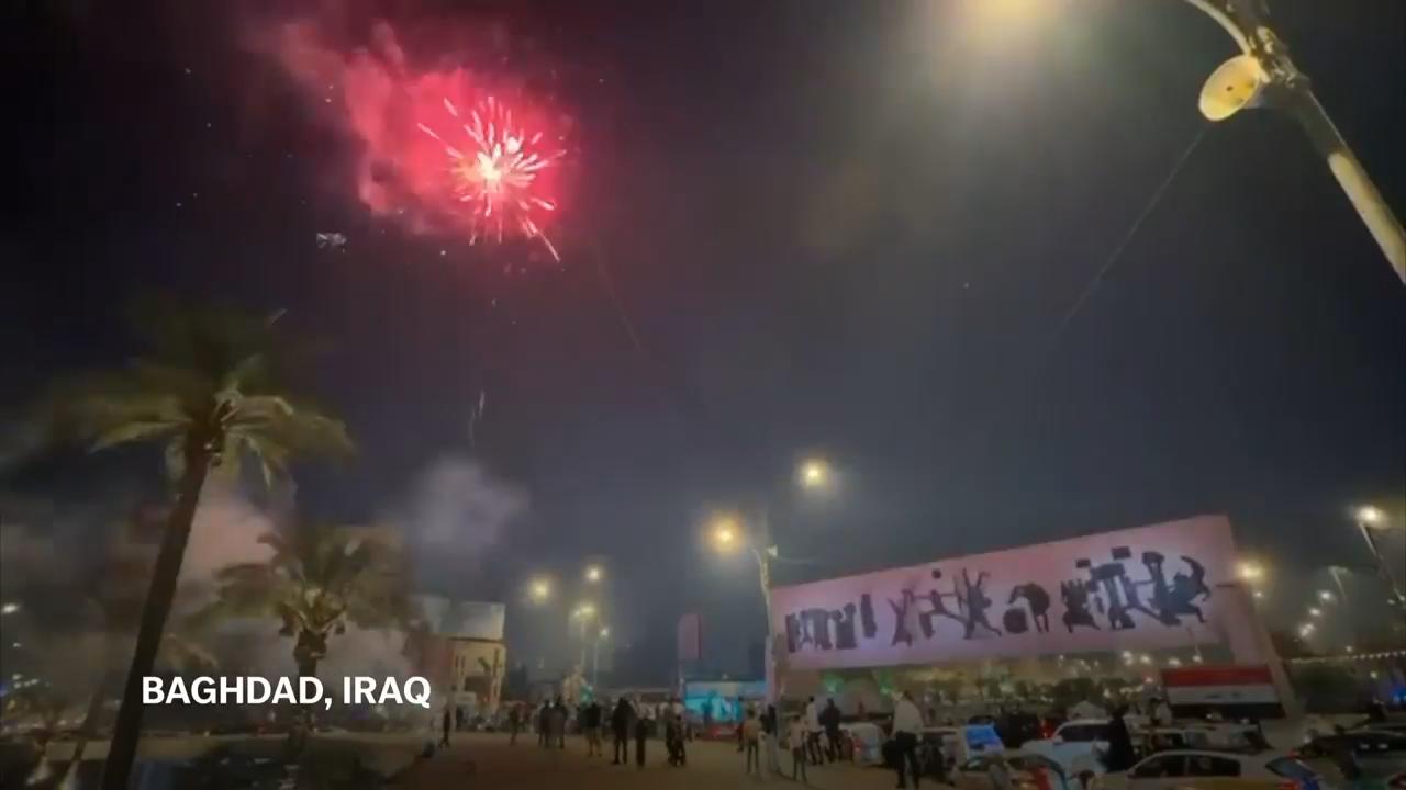 Supporters of Iraqi Prime Minister celebrate his election win in Baghdad