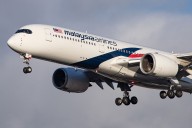 2 Passenger Planes Narrowly Miss Construction Workers While Taking Off