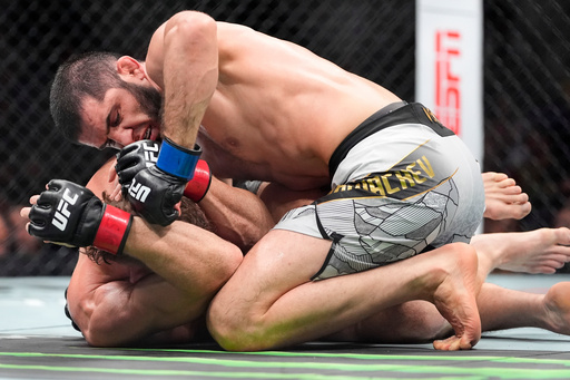 Islam Makhachev wins 170-pound title, ties UFC record with 16th straight victory
