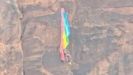 BASE jumper rescued after crashing into cliff and dangling from parachute in Utah