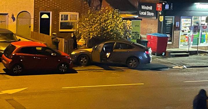 Car smashes into resident's garden after two vehicle crash