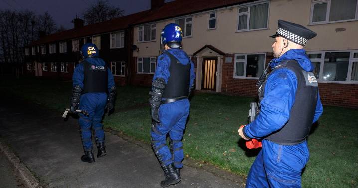 Cops swarm Greater Manchester suburb and raid homes as 15 arrests made