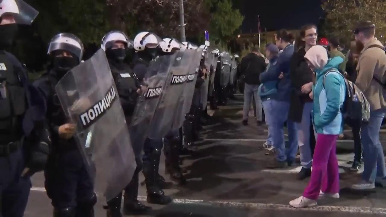 Riot police separate opponents, loyalists of Serbia's president as tensions soar amid protests