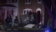 Car rolls over into house in Milton