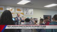 Rep. Nathaniel Moran takes part in music class at Caldwell Art Academy