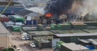 Massive warehouse fire as 150 firefighters scramble to tackle flames