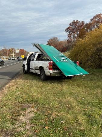Two men accused of trying to steal exit signs on I