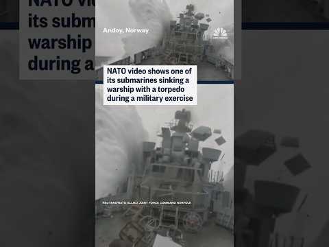 NATO footage shows one of its submarines sinking a warship with a torpedo during a military exercise