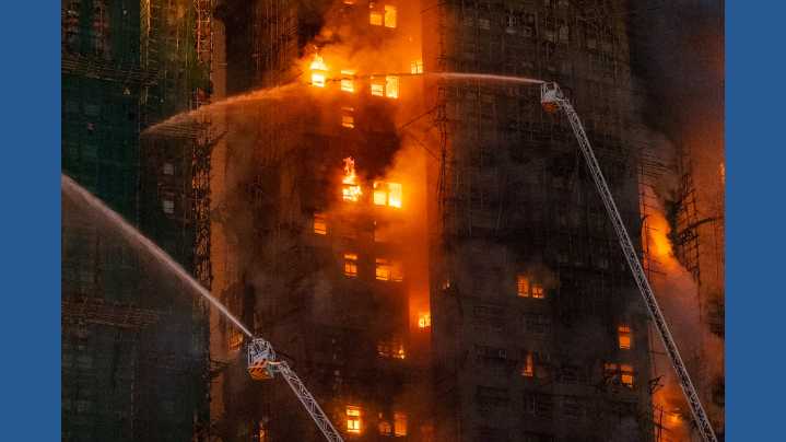 13 people killed in fire engulfing Hong Kong high-rise residential buildings, fire services say