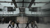 BBC leaders grilled by lawmakers over its standards after Trump threatened to sue