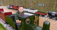 Train enthusiast builds miniature railway in his backyard