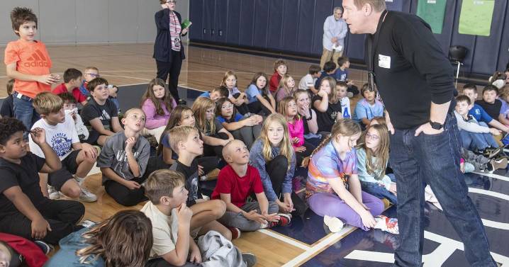 More than 700 Warrior Run Elementary students meet with muralist about upcoming spring project