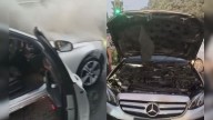 Delhi: Police save woman and child as Mercedes car erupts in flames at traffic signal