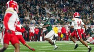 Michigan State sprints past Maryland, 38-28, for 1st Big Ten win